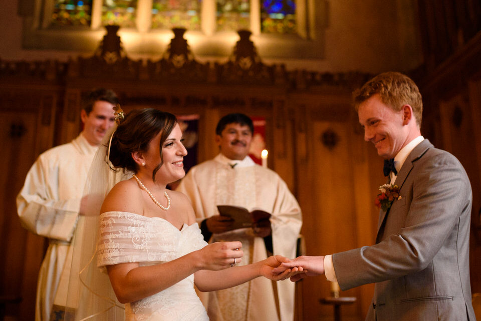 Wedding ring exchange in front of priest