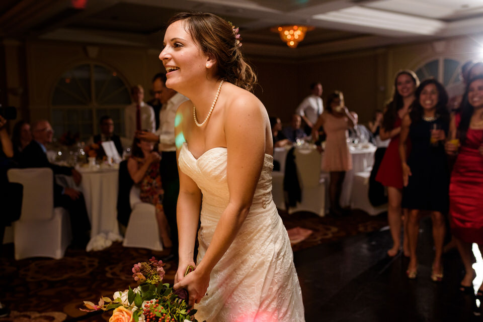 Bride throwing bouquet 