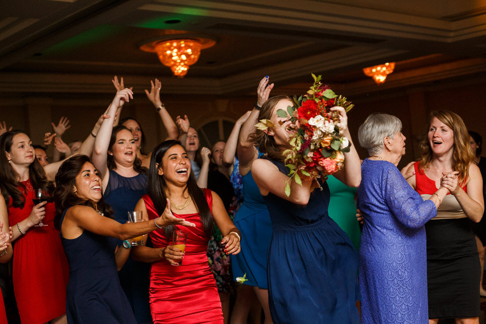 Wedding guest catching bouquet