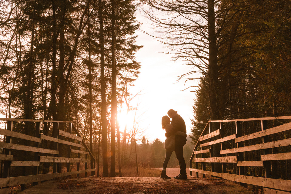 Mont-Tremblant engagement photo of couple silhouetted by sunset