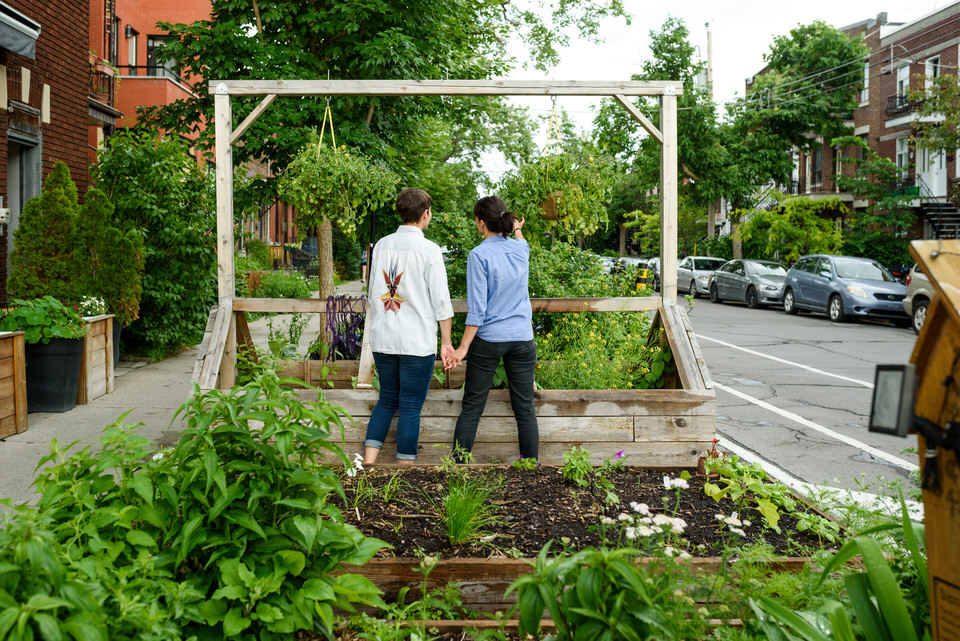 Gay couple exploring urban gardens in Montreal