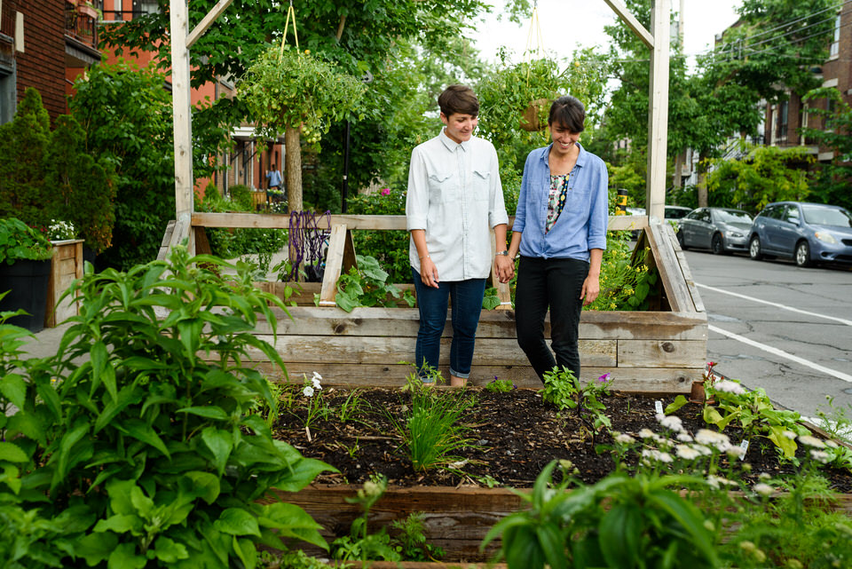 Gay couple exploring urban gardens in Little Italy