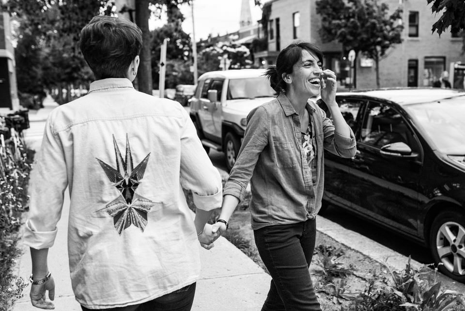 Black and white photo of LGBT couple laughing  