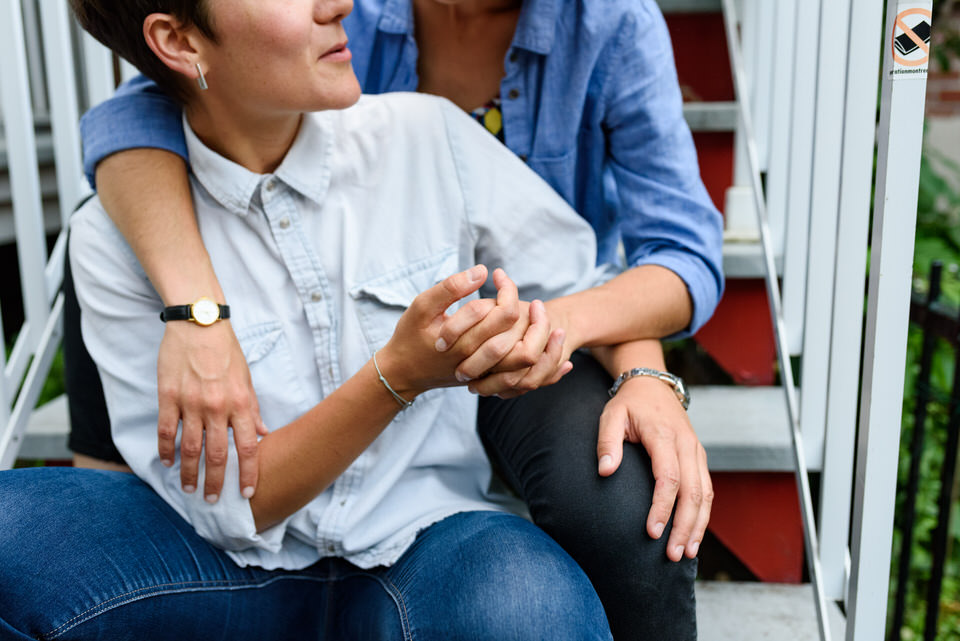 Couple holding hands on stairs