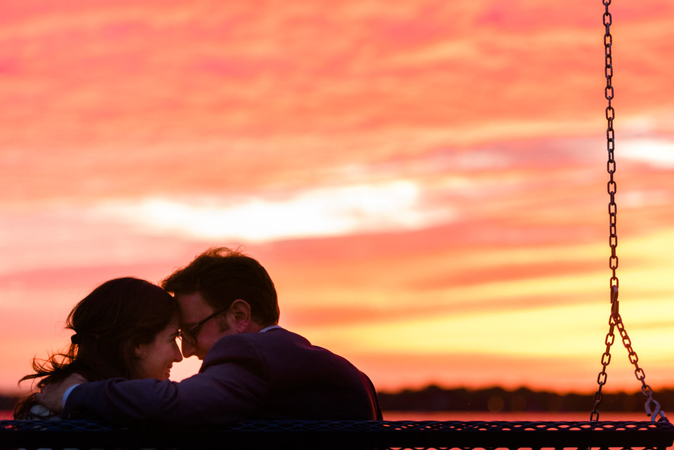 Happy newly engaged couple after sunset surprise proposal