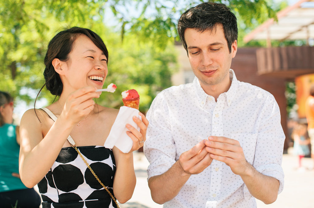 Couple enjoying ice cream during summer engagement photos