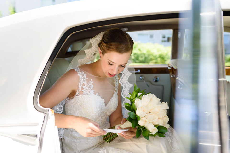 Bride reading her vows over in limo before ceremony