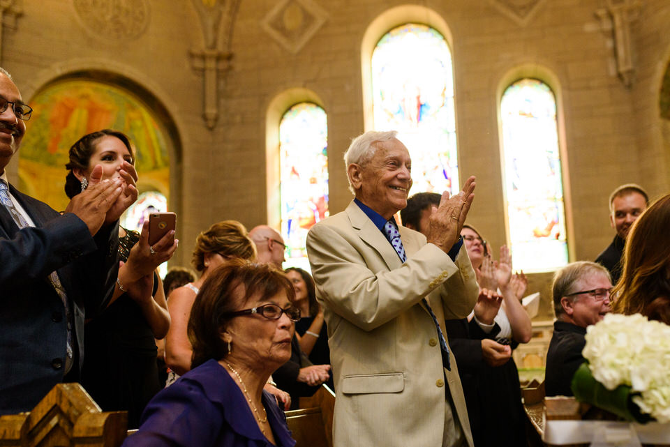 Guests clapping at wedding ceremony