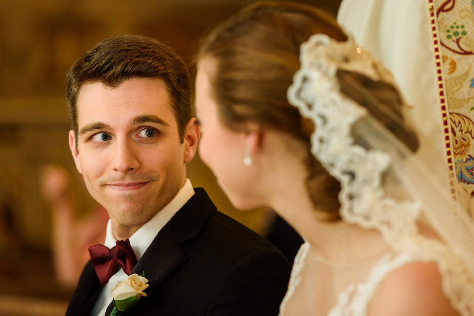 Groom looking at bride during ceremony