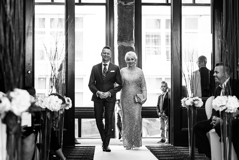 Groom and mother entering Hotel Nelligan wedding ceremony