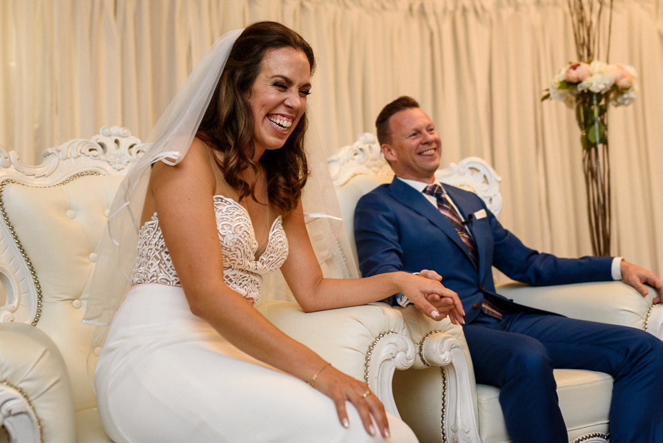 Bride and groom laughing during Hotel Nelligan wedding ceremony