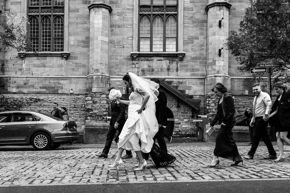 Bride walking on cobblestone street in Old Montreal