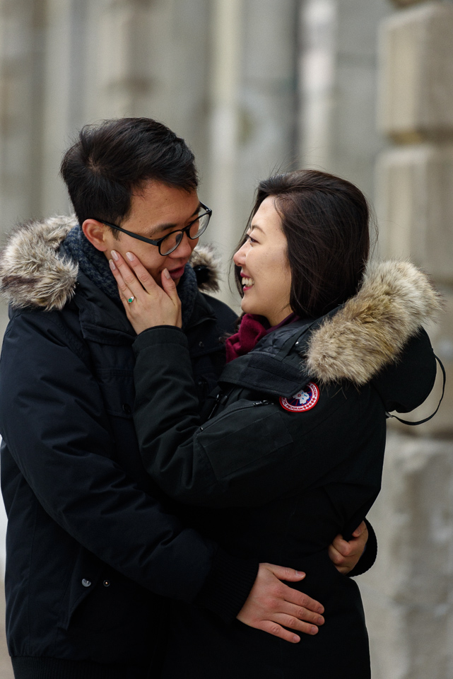 Happy engaged couple embracing in Old Montreal