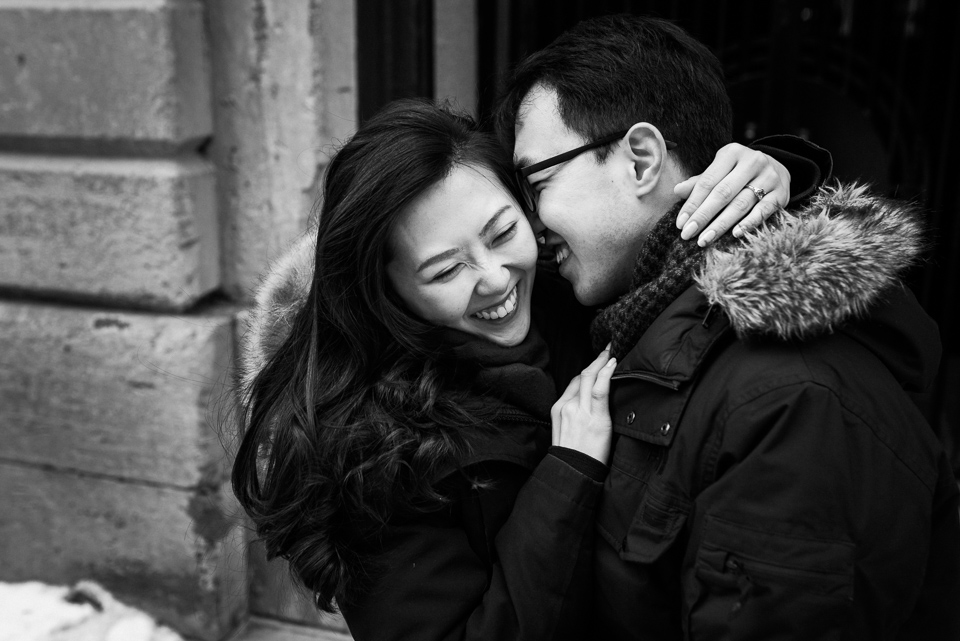Laughing photo of engaged couple in winter shoot