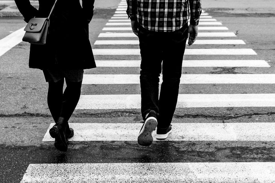 Couple walking across crosswalk