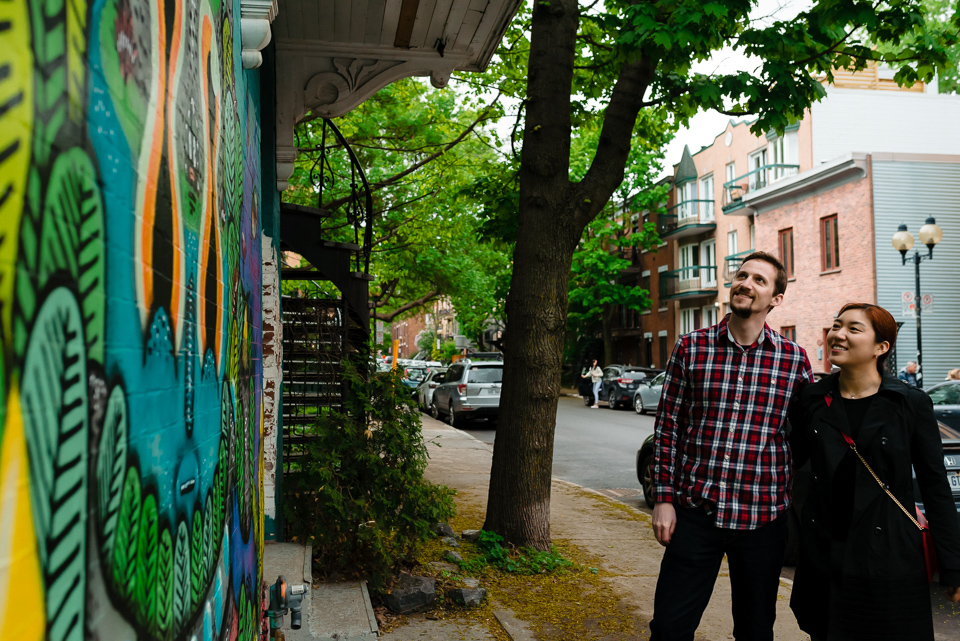 Couple enjoying graffiti walk in Mile-End Montreal