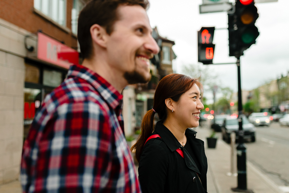 Couple waiting at red light to cross street