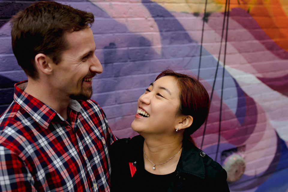 Couple laughing during documentary couples photo shoot
