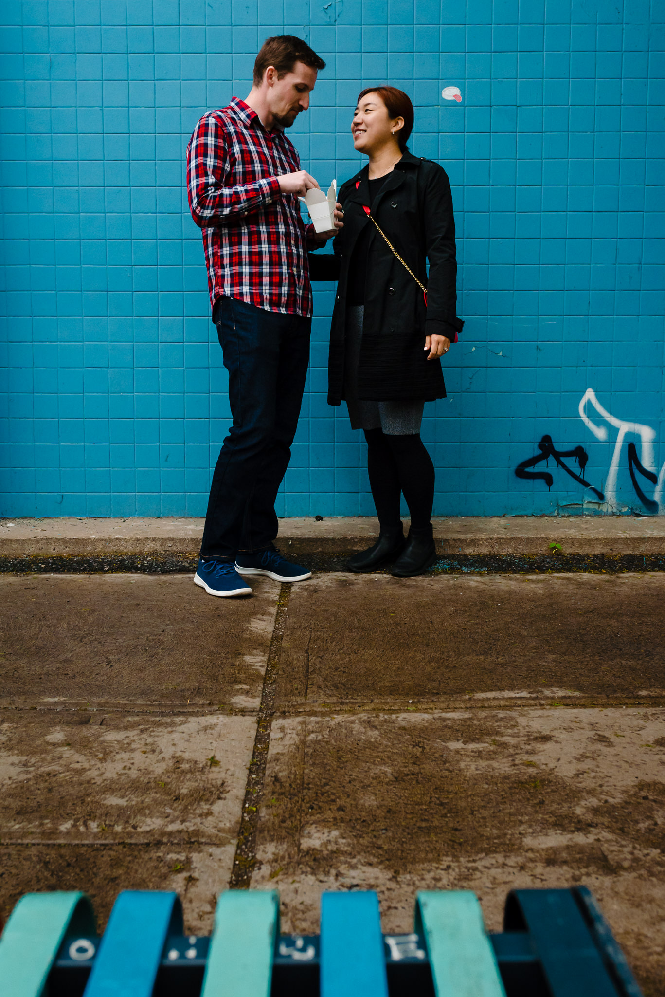 Couple vacation photo in Mile-End Montreal with blue wall