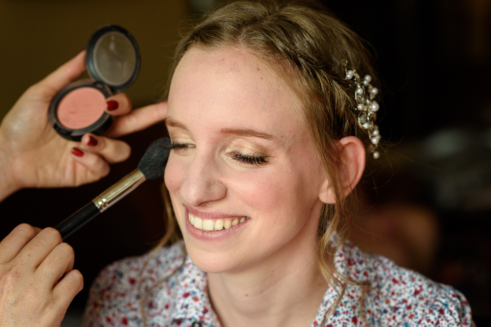 Bride getting makeup done