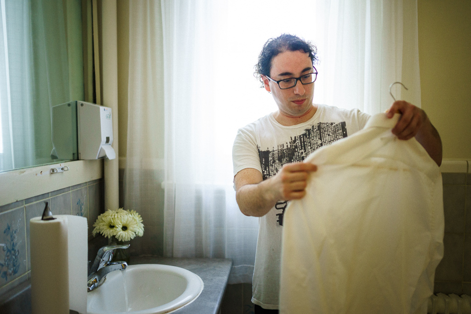 Groom getting his white shirt out