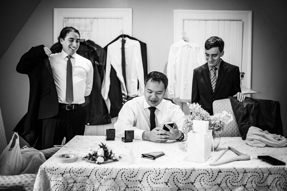 Groom and friends getting dressed