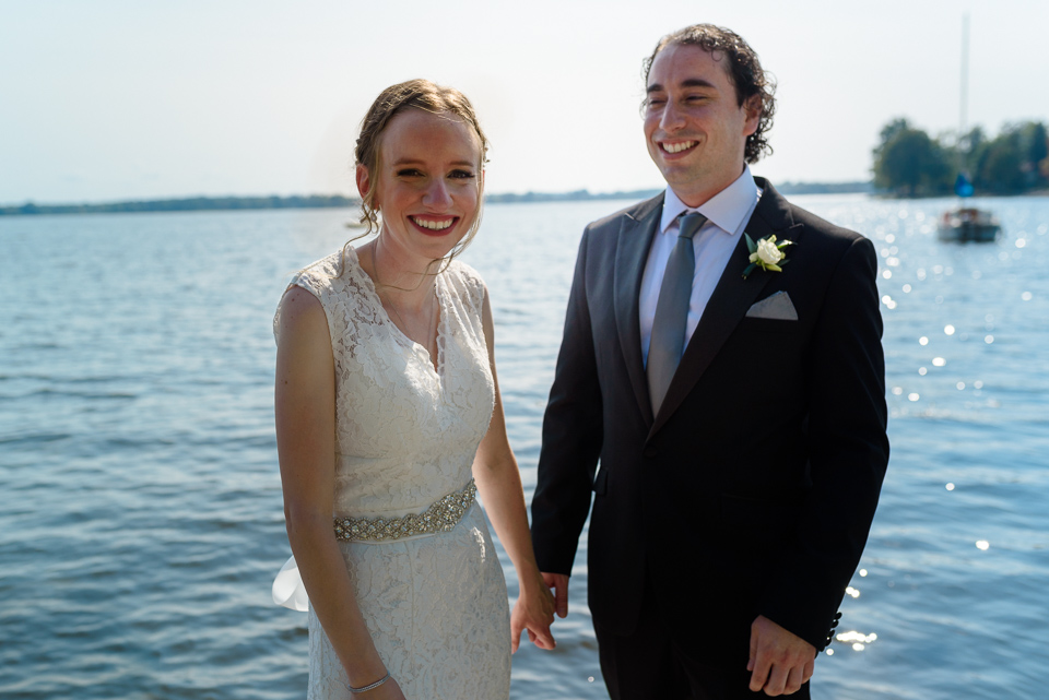 Wedding couple with river behind them