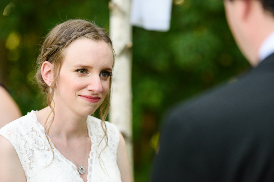 Bride looking at groom at outdoor wedding ceremony