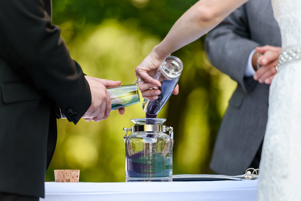 Sand ceremony at outdoor wedding