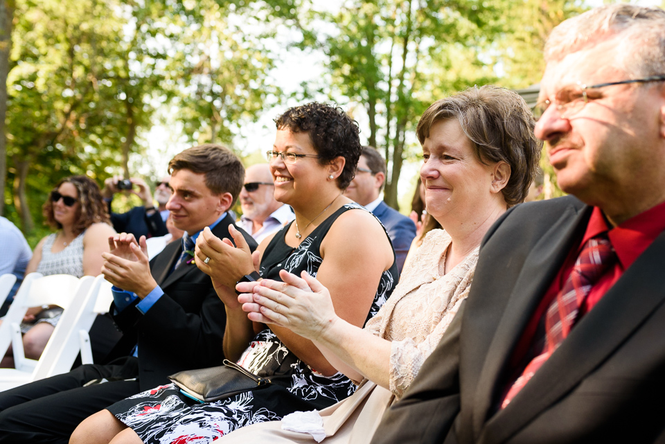 Family clapping during wedding ceremony