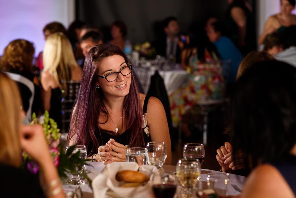 Wedding guest smiling at dinner