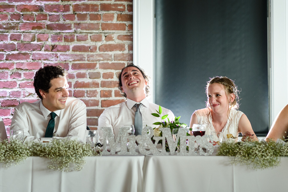 Groom laughing at speech at Canvas Montreal