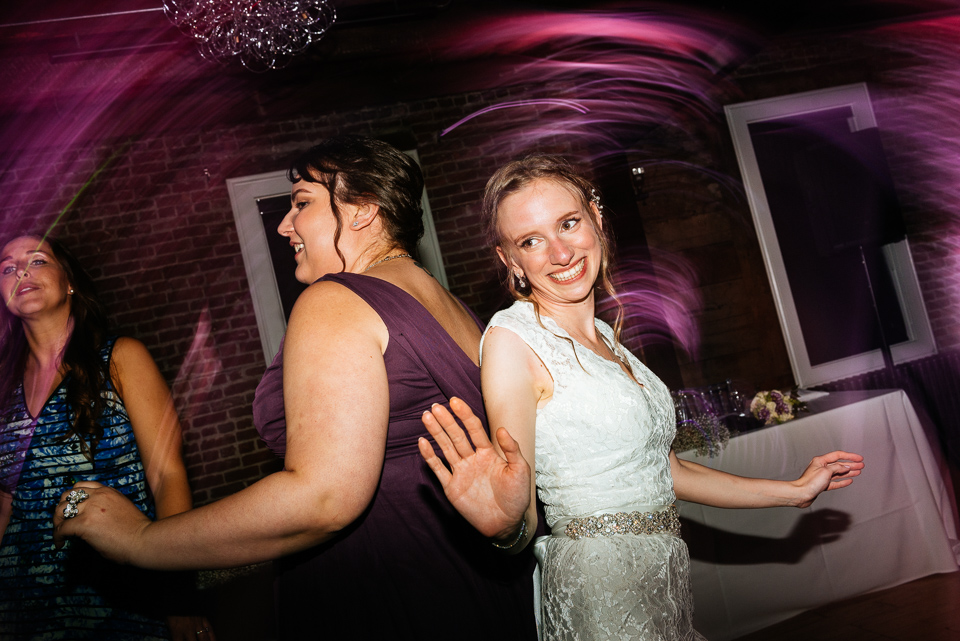 Bride dancing with bridesmaid