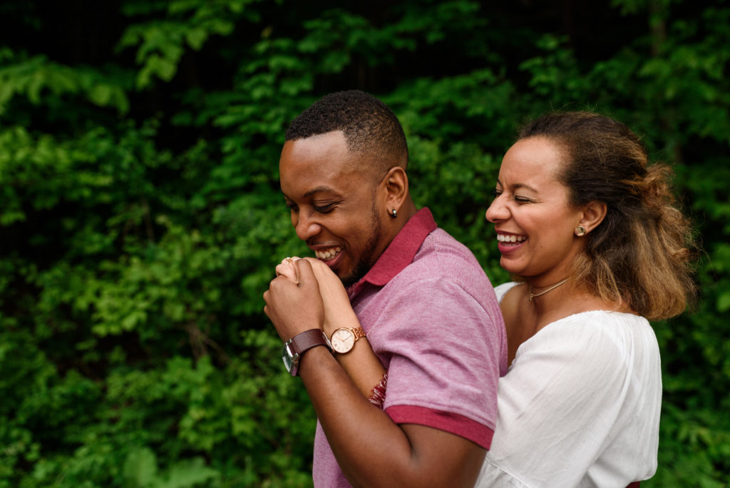 Engagement photo of couple kissing hands