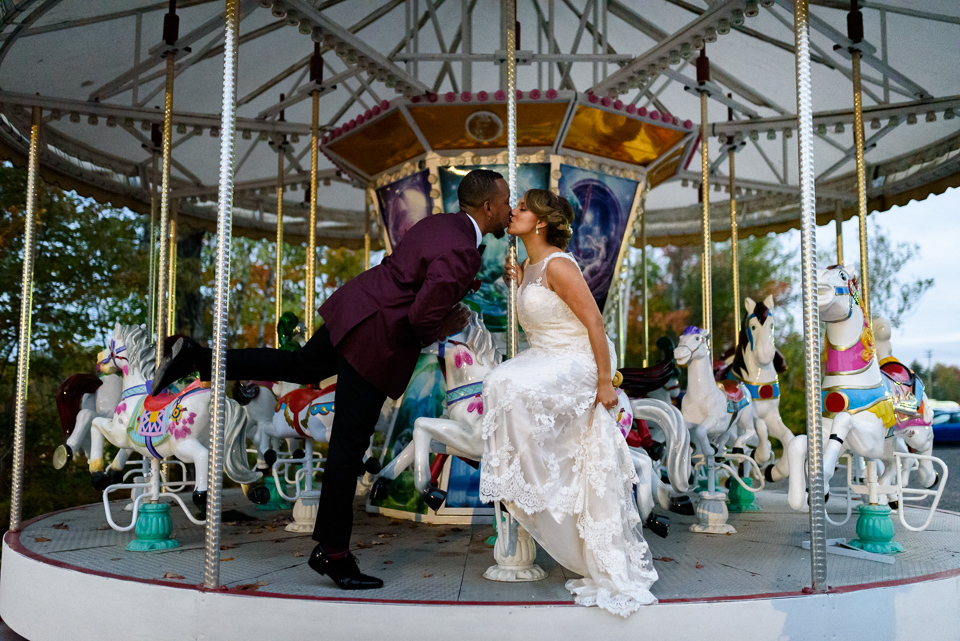 Wedding portrait on a carousel at Chalet des Erables