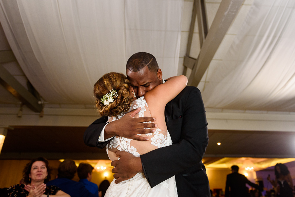 Emotional brother hugging the bride