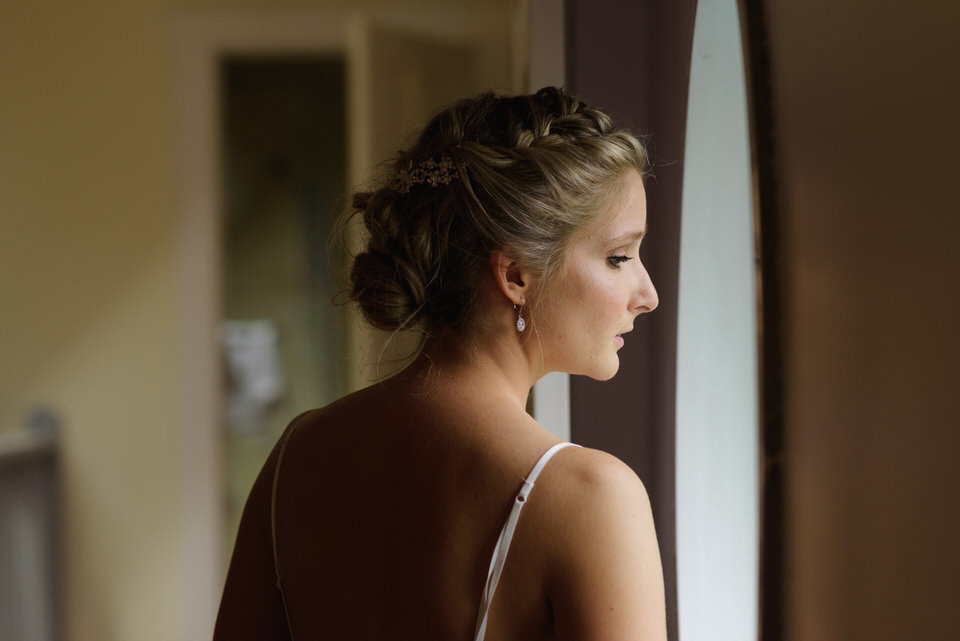 Bride looking out the window nervously