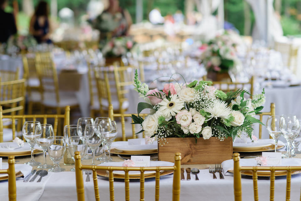 Rustic chic floral centerpiece on outdoor wedding table