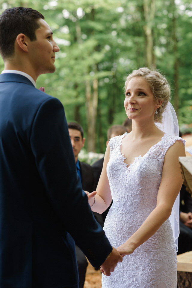 Bride looking at groom during wedding ceremony