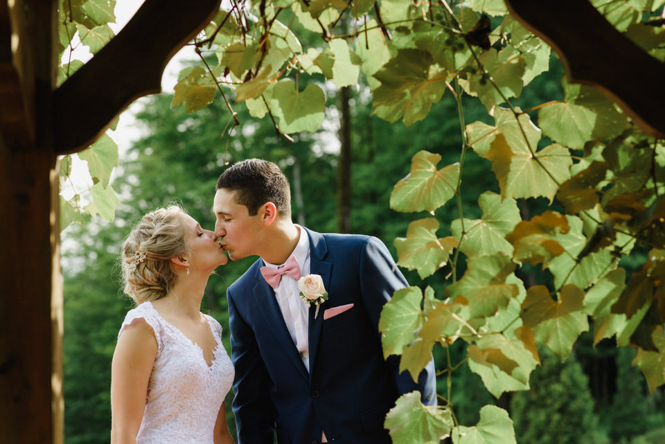 Wedding portrait framed by vines