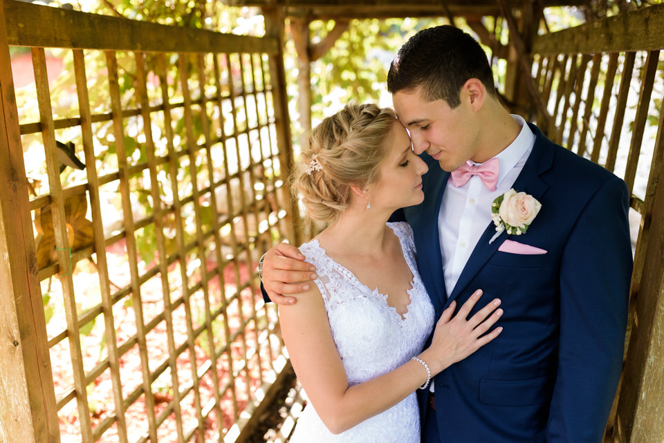 Wedding portrait in an archway at a vineyard