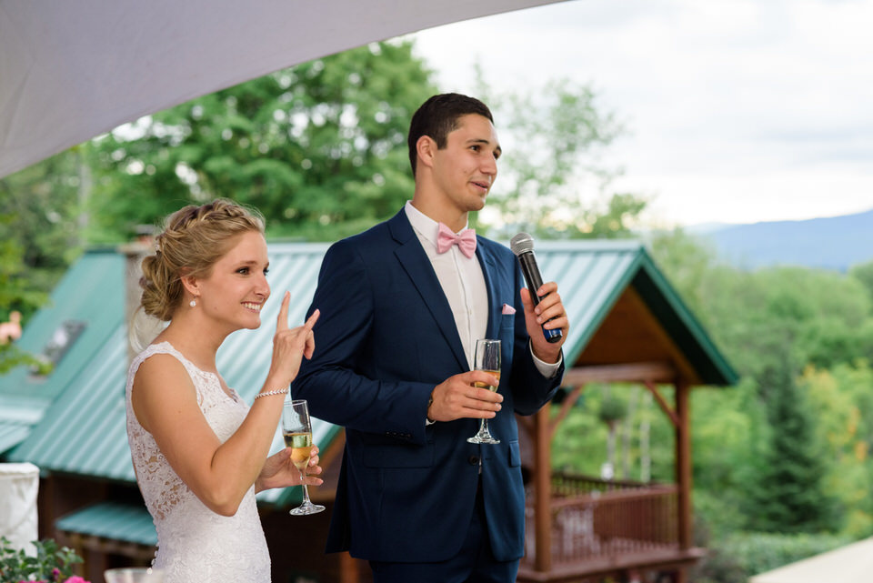 Bride and groom giving welcome speech