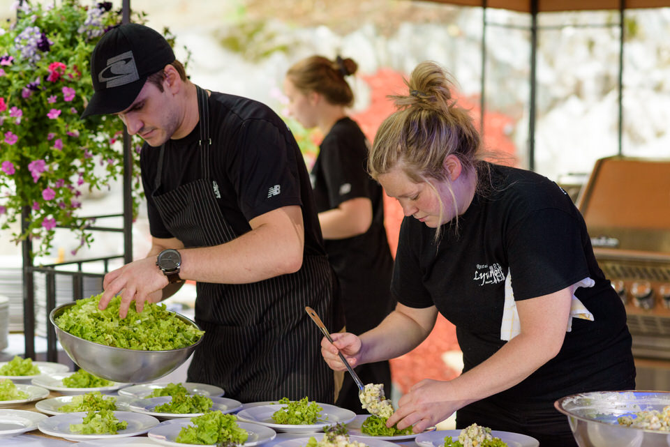 Catering staff from Restaurant Lyvano preparing wedding food