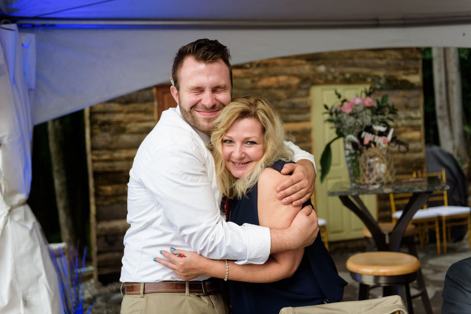 Friend hugging bride's mom