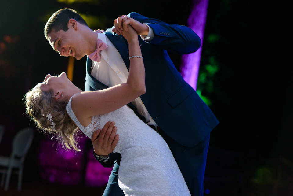 Groom dipping bride during first dance