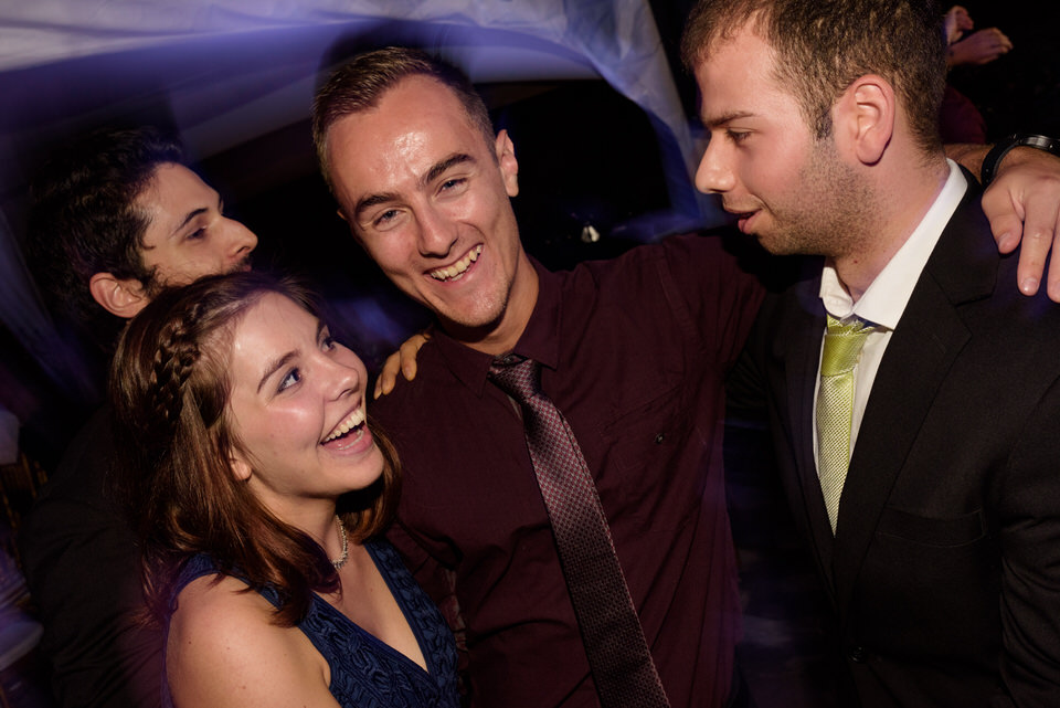 Wedding guests laughing together