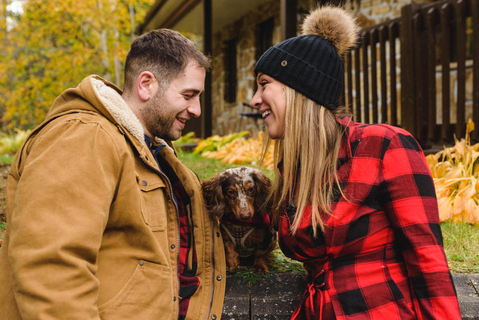 Fall engagement photo with their dog