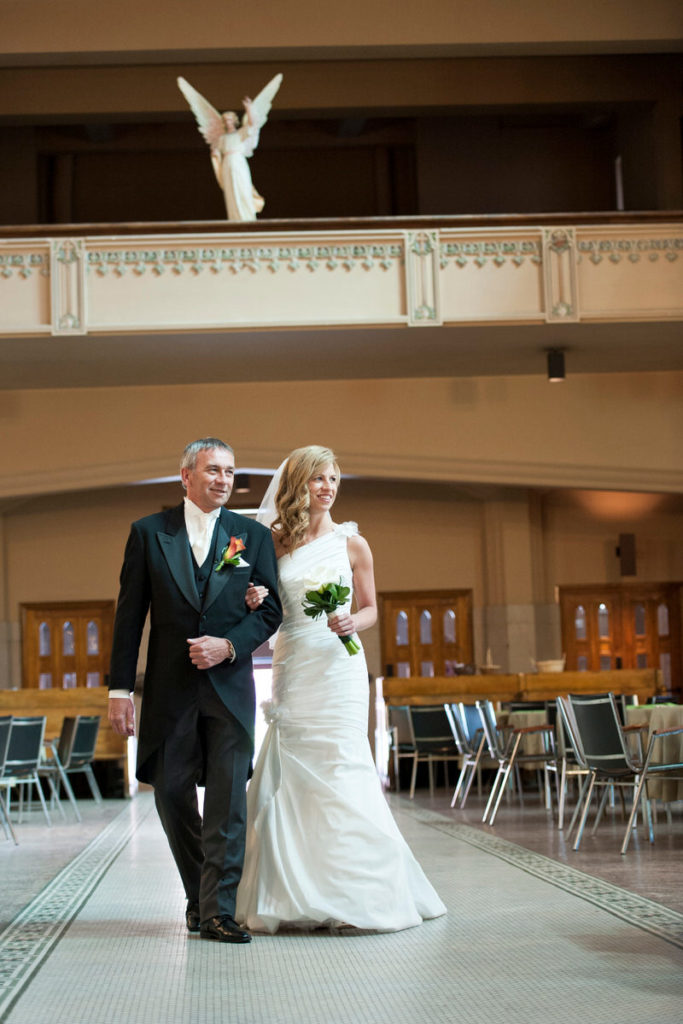 Bride and her father walking into church