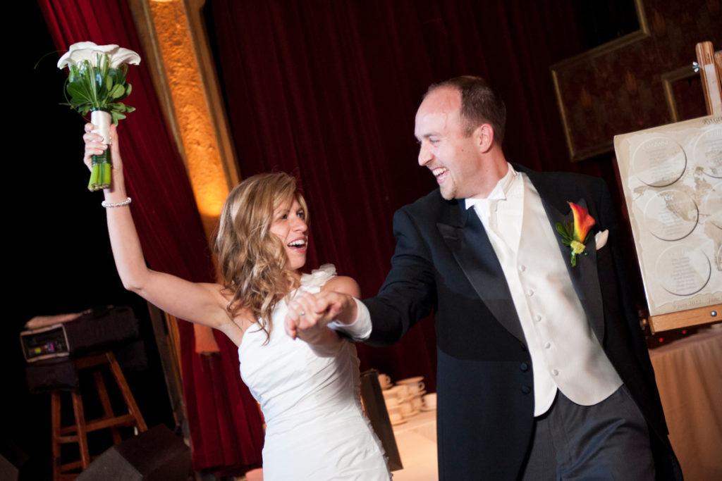 Wedding couple running in to reception at Cabaret Lion d'Or