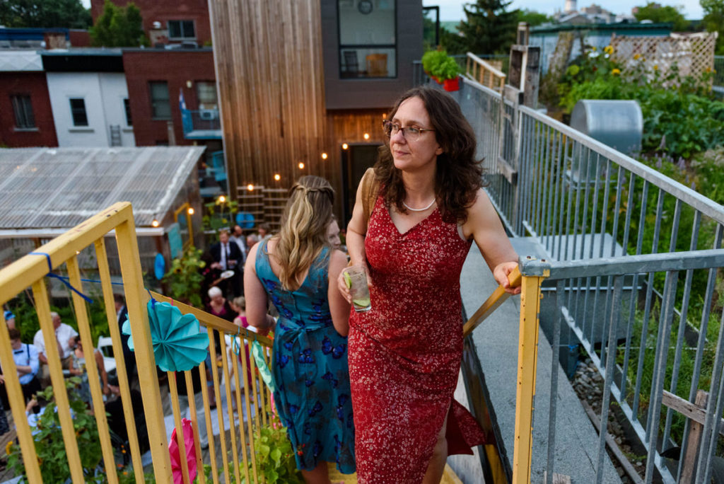 Wedding guest climbing the stairs to rooftop garden